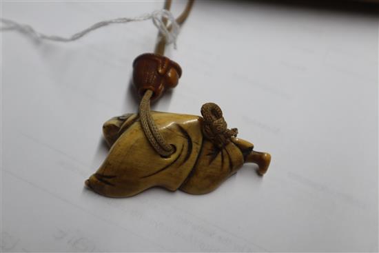 A 19th century Japanese gold lacquer five case inro, signed, together with an 18th/19th century ivory netsuke and a ojime